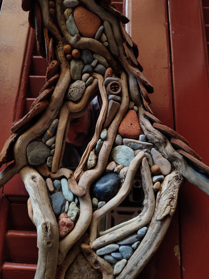 Wicked driftwood housefront wall art